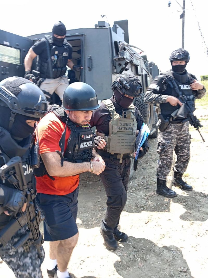 Ecuador's prison authorities provided this photo showing Jose Adolfo Macias, better known as “Fito,” being escorted by police officers in Guayaquil, Ecuador, as he was extradited to the US on Sunday, July 20, 2025.